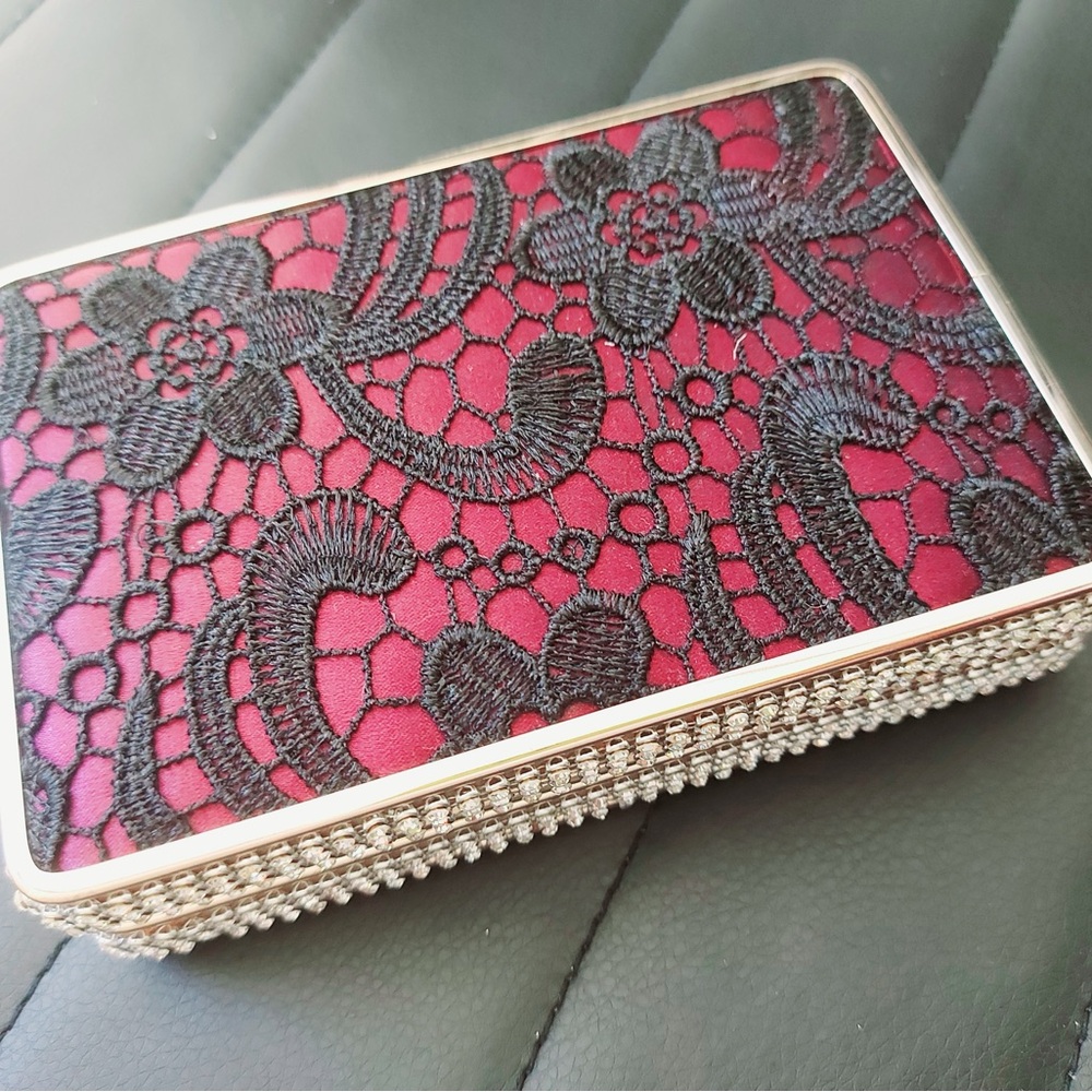Elegant Black Lace Clutch with Red Underlay